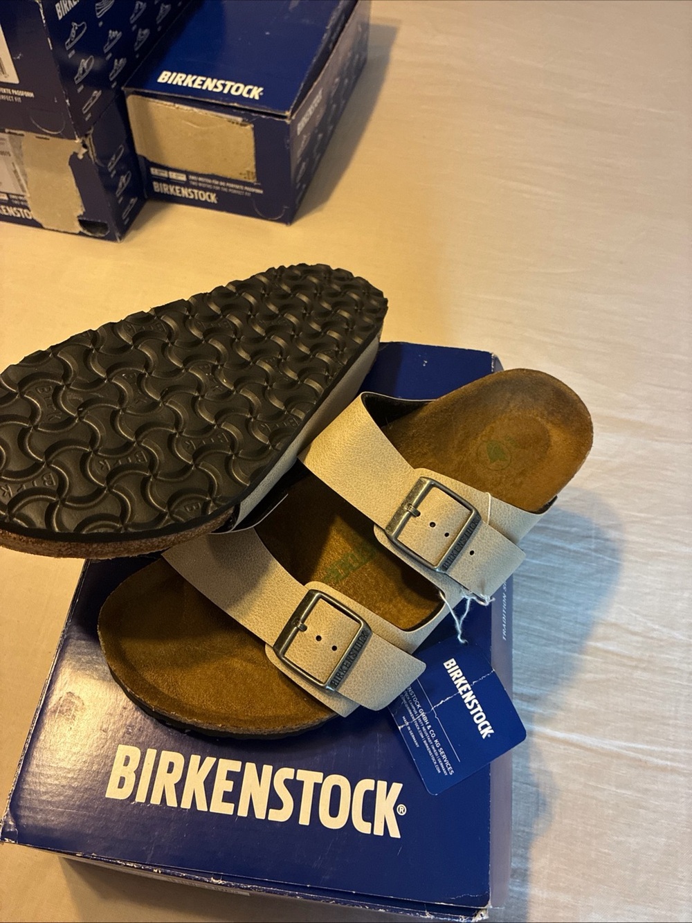 Birkenstock Arizona Men's Two-Strap Sandal in Light Tan with Black Sole